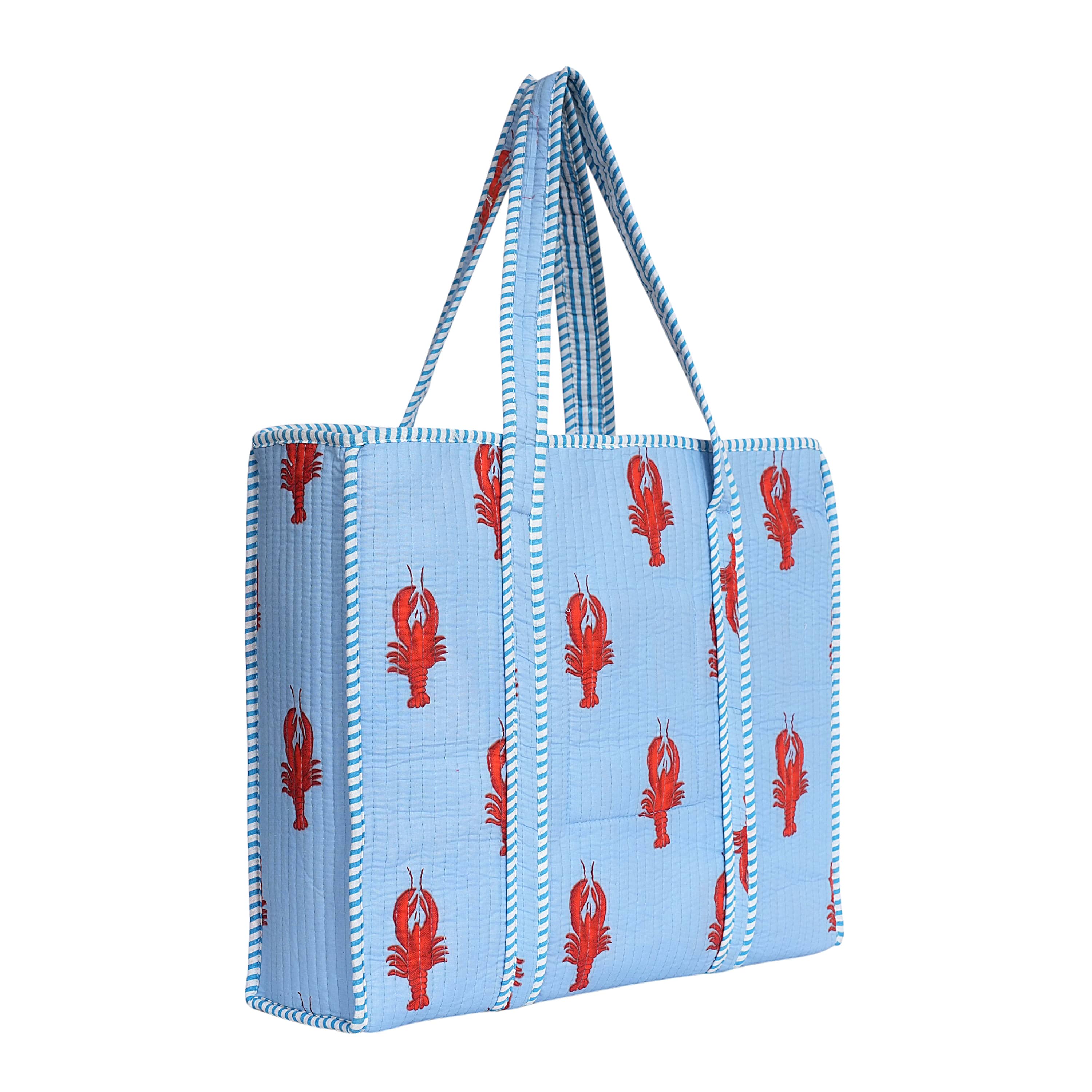 Open view of The Lobster Tote showing the lined cotton interior with capacity for a laptop and a beach towel