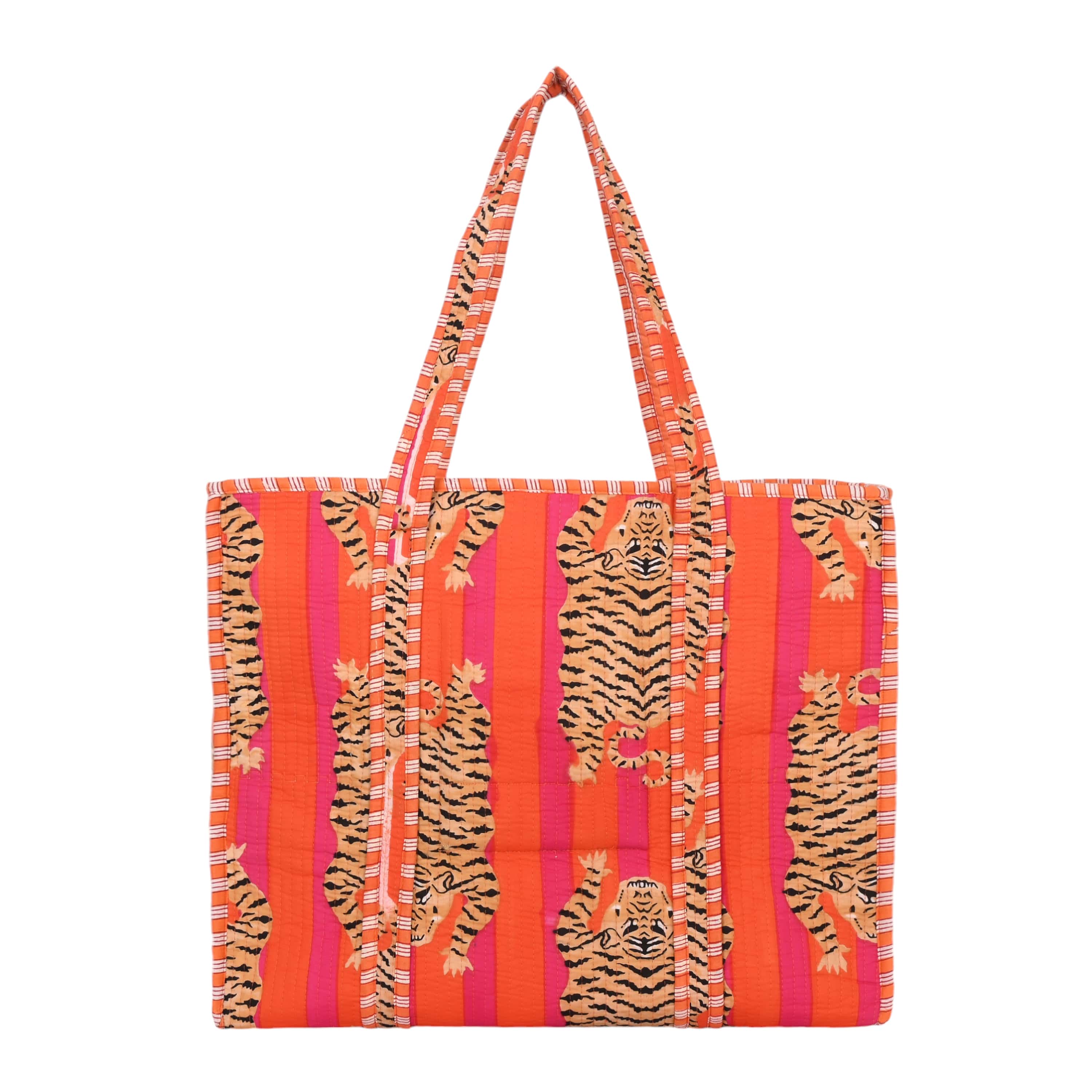 The Tibetan Tiger Tote in blue cotton with the hand-block-printed Tibetan tiger motif as the focal print
