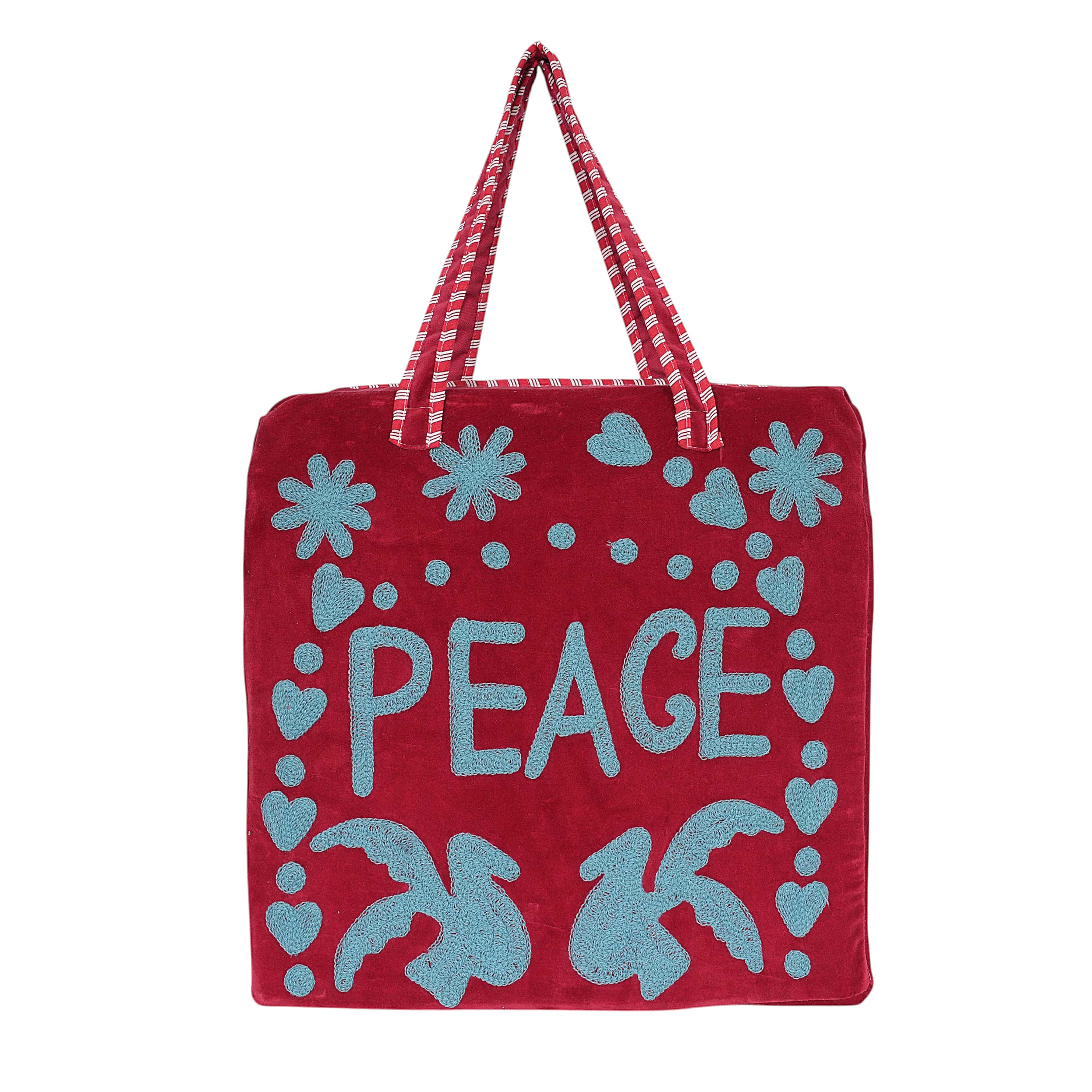Front view of the Peace Suzani Tote in natural cotton with the bold red suzani embroidery-inspired print