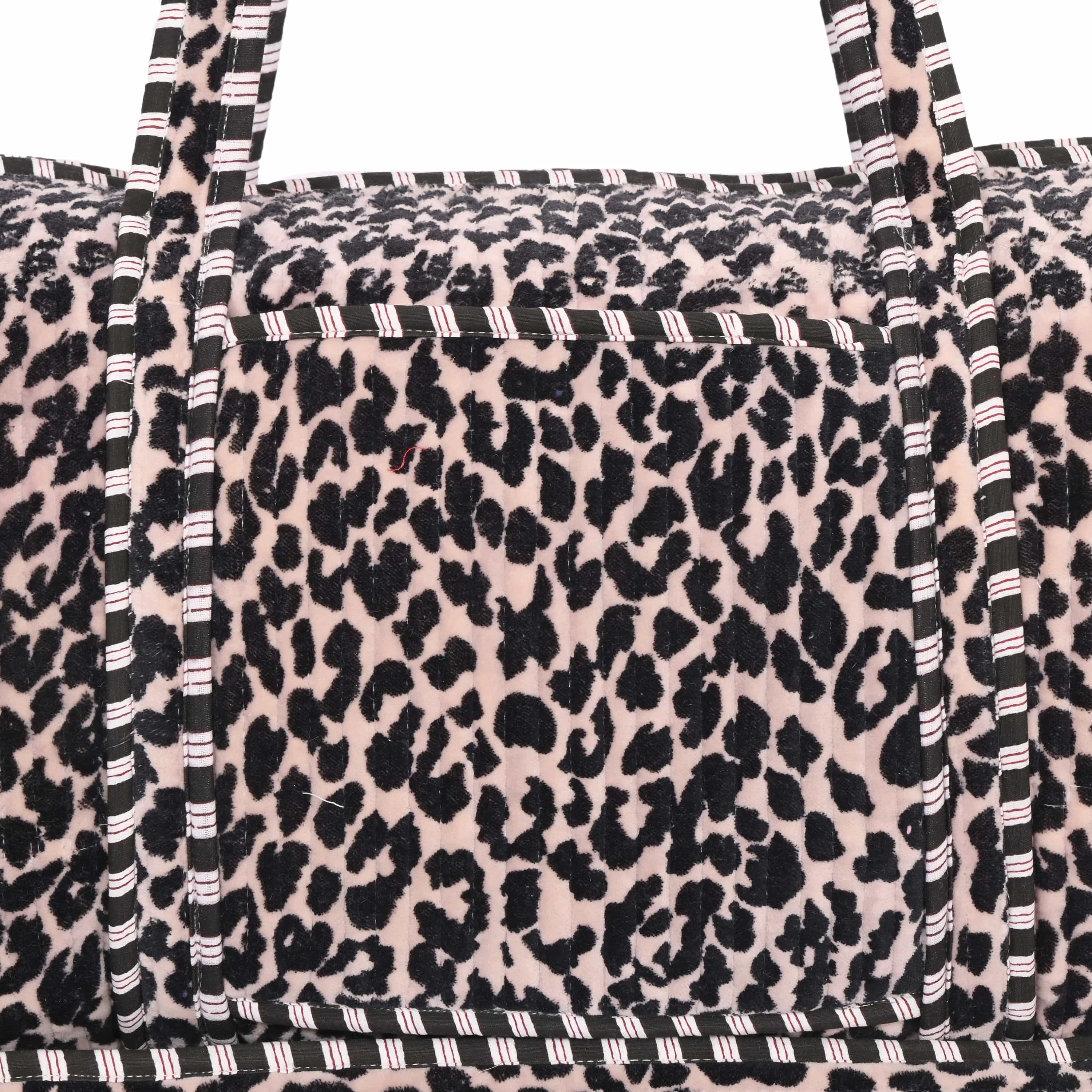 Detail of the hand-block-printed leopard motif sinking into the cotton velvet pile
