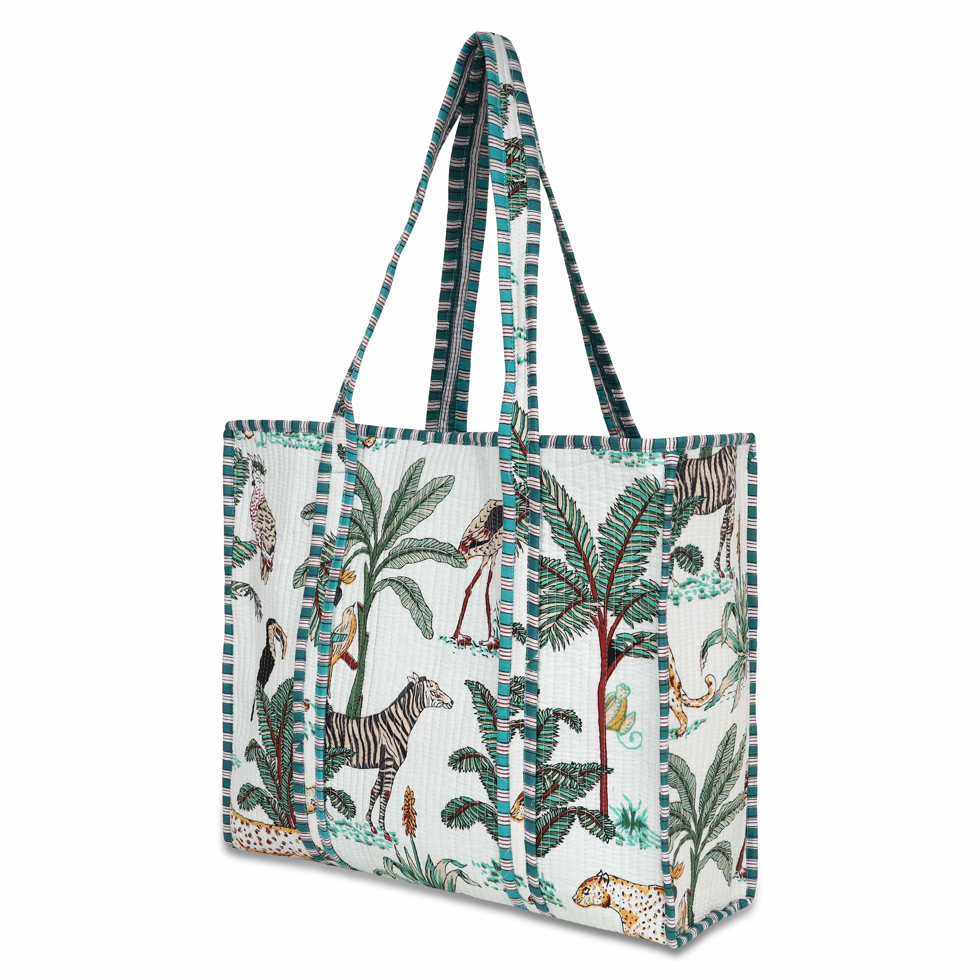 Front view of The Jungle Tote in cream cotton with hand-block-printed parrots, palms, and tropical foliage in saturated colour