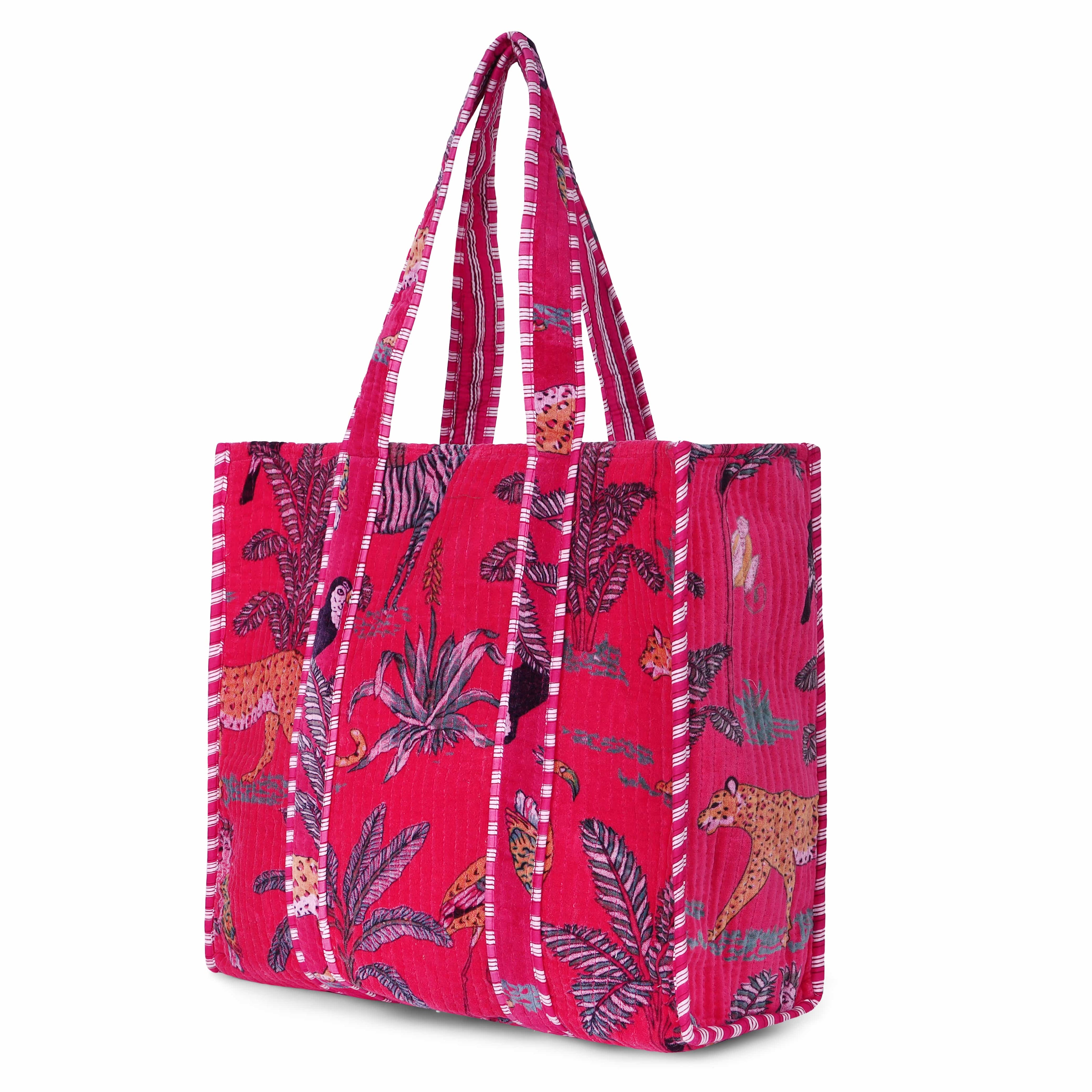 Front view of The Jungle Tote in Velvet in deep saturated colour with the hand-block-printed jungle motif of palms, parrots, and tropical blooms