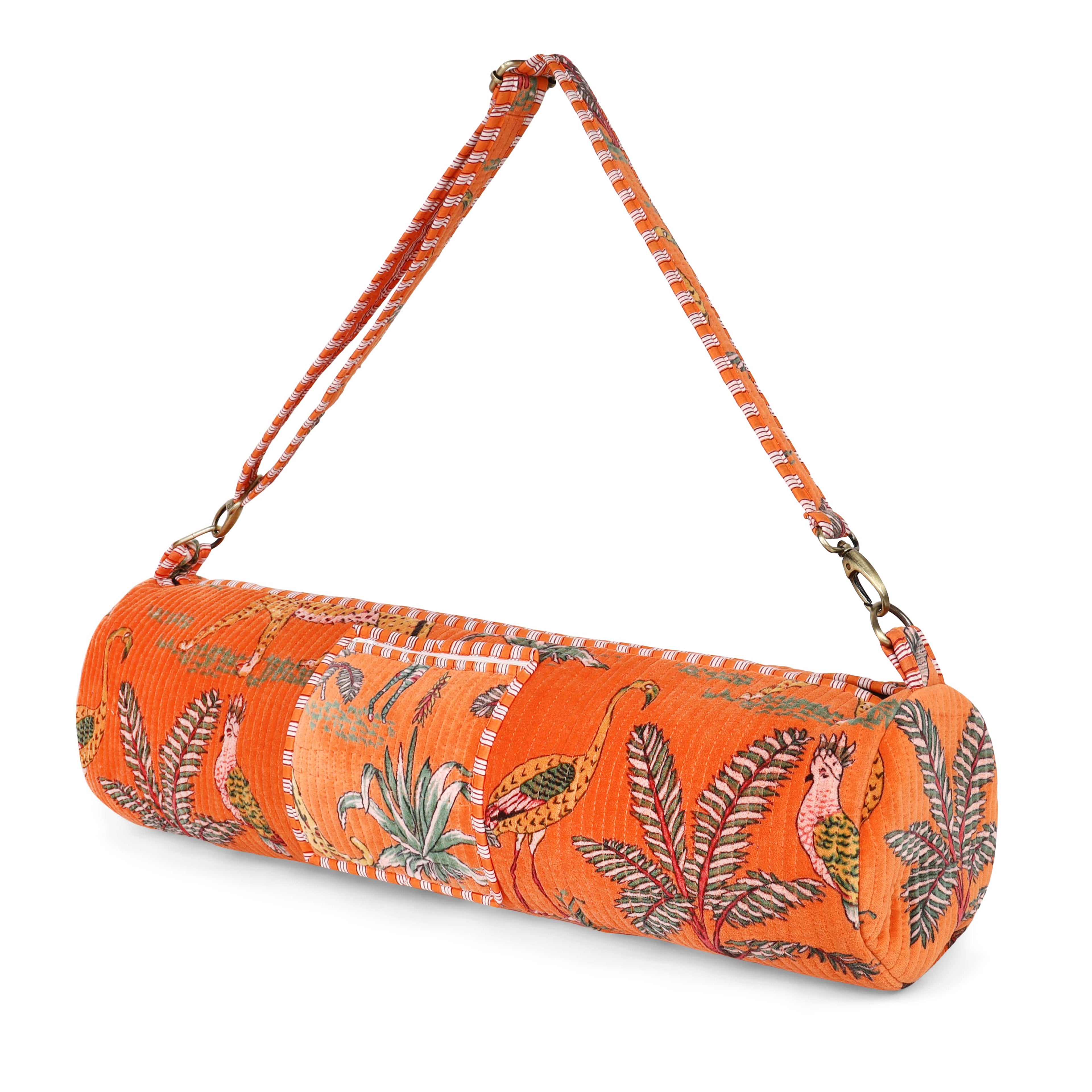 Front view of The Jungle Velvet Yoga Bag in deep saturated colour with the hand-block-printed jungle print across the body