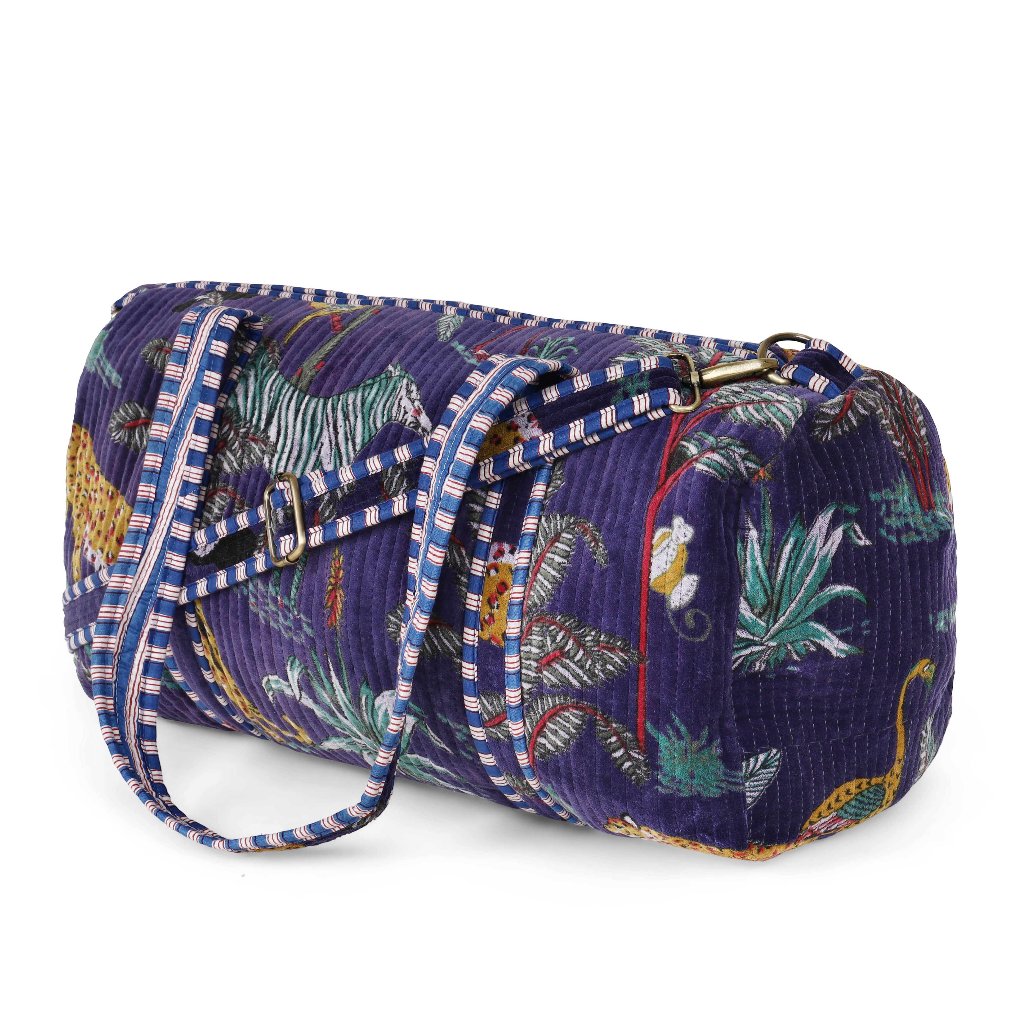 Open view of The Jungle Velvet Weekender showing the lined interior and inside pocket