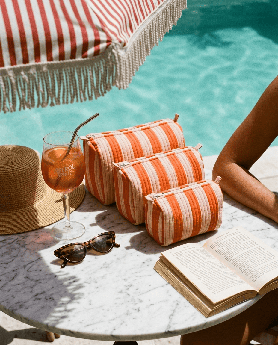 Marble poolside table with the Striped Cotton Travel Set in Orange — handmade in Rajasthan by Conscious Yoga Collective