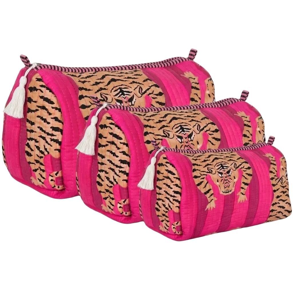Tibetan Tiger 3 Piece Travel Set in hot pink cotton with cream tassel zip pulls, handmade travel pouch set, ethically crafted in Rajasthan, studio shot.