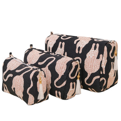 Set of three decorative boxes with black and beige abstract patterns on a white background