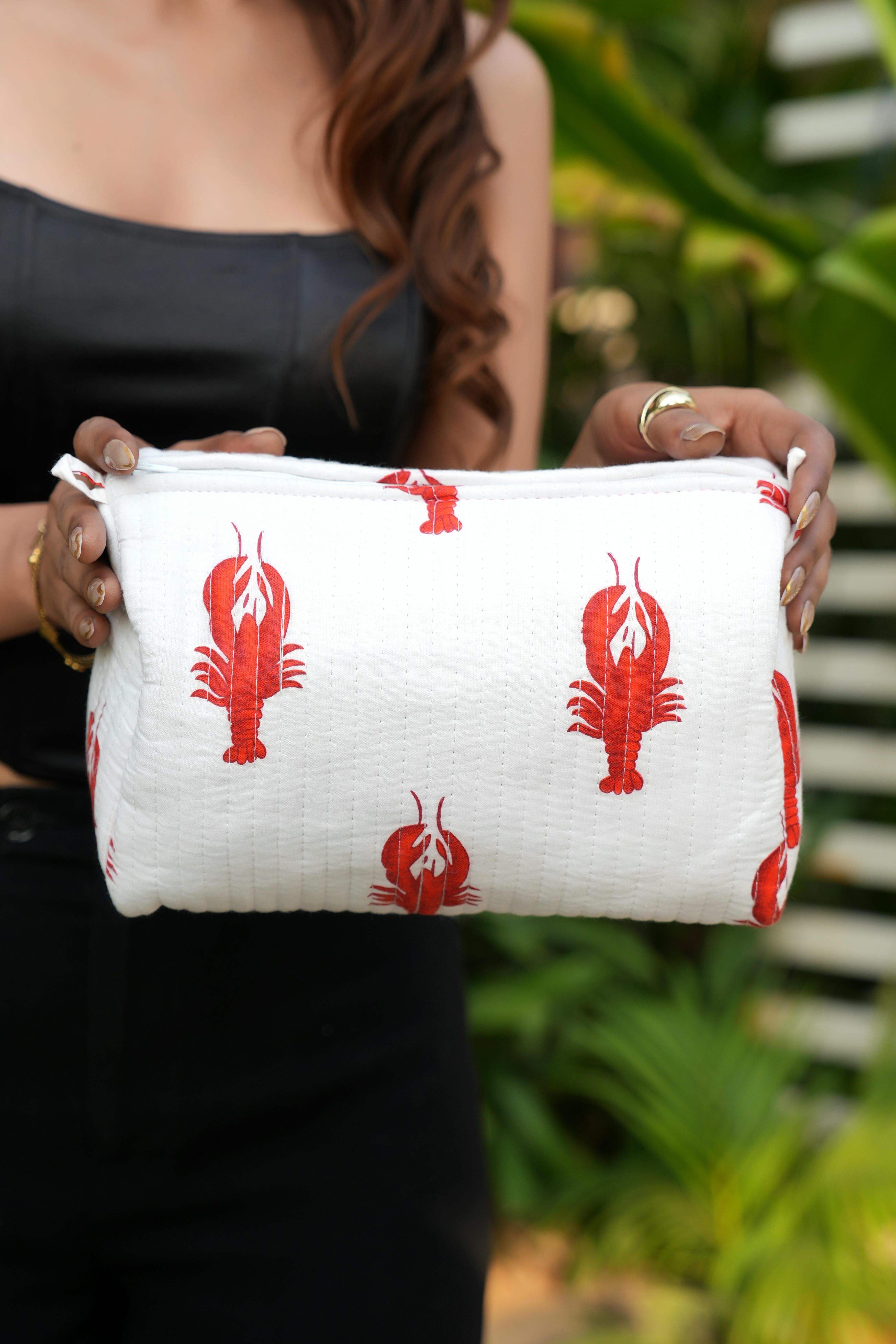 The Lobster Travel Set — close-up of the white pouch showing straight quilted stitching; handmade cotton travel pouch set, ethically made in Rajasthan.