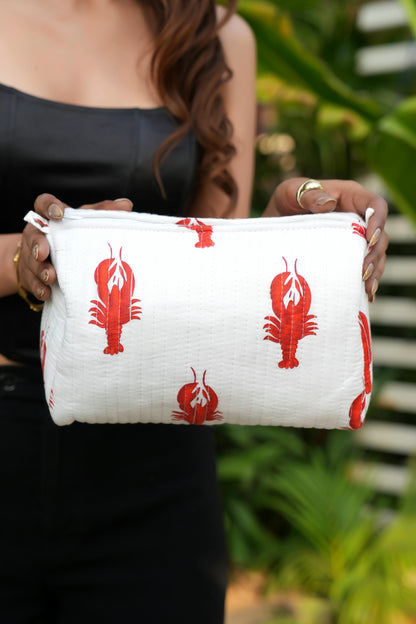 The Lobster Travel Set — close-up of the white pouch showing straight quilted stitching; handmade cotton travel pouch set, ethically made in Rajasthan.