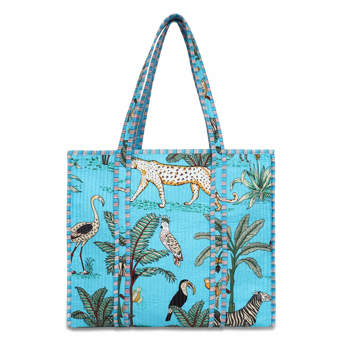Front view of The Jungle Tote in cream cotton with hand-block-printed parrots, palms, and tropical foliage in saturated colour