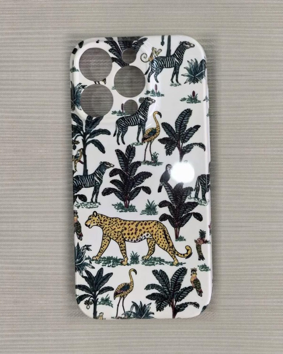The Jungle iPhone Case in Cream — close view of the glossy printed back and camera cutout