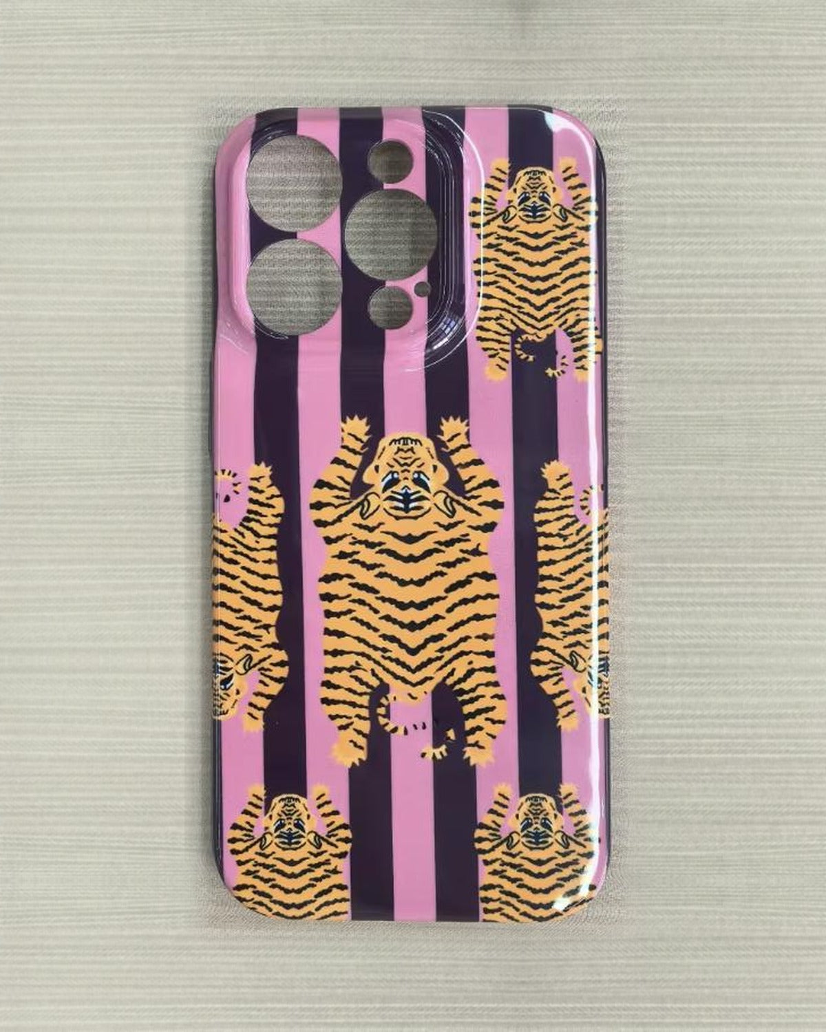 The Tibetan Tiger iPhone Case in Mauve Plum — close view of the glossy printed back and camera cutout