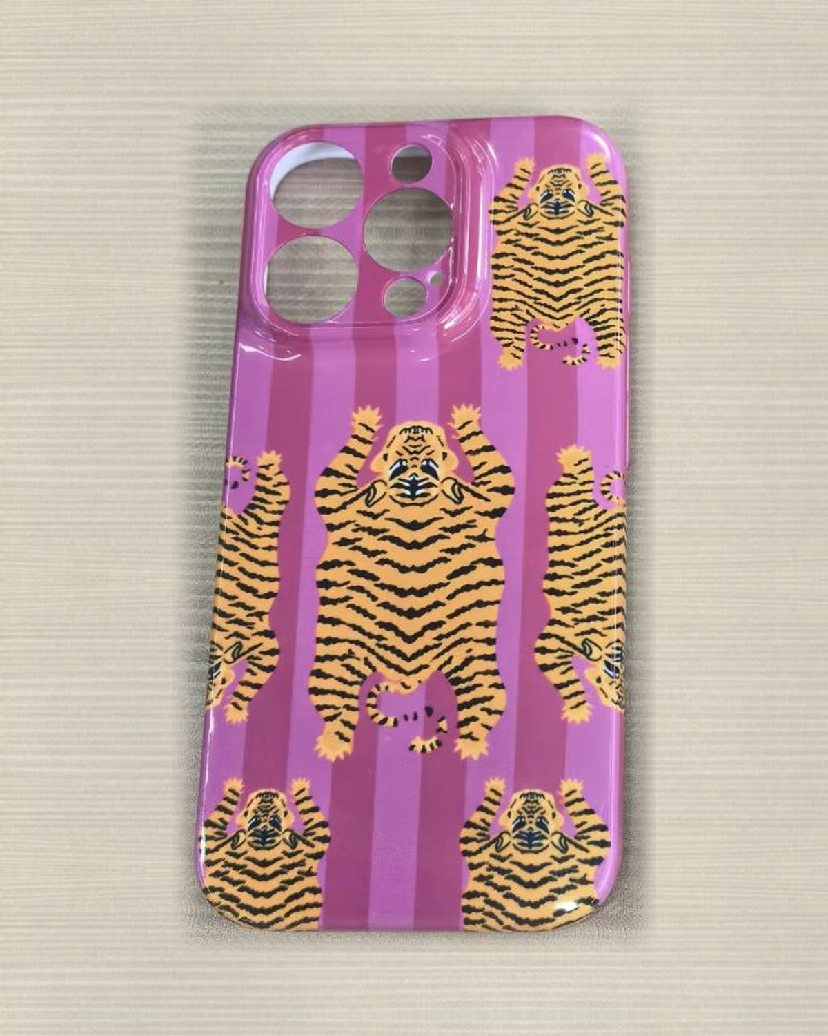 The Tibetan Tiger iPhone Case in Pink — close view of the glossy printed back and camera cutout
