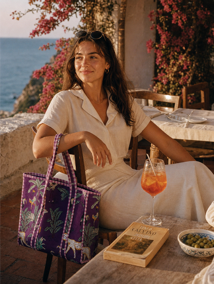 Café terrace aperitivo with the Leopard Tote in purple — Aperol on linen, hand-block-printed cotton from Conscious Yoga Collective