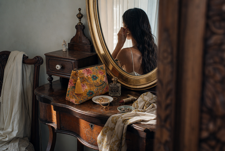 Open view of the Amber Lotus Velvet Makeup Bag showing the plastic-lined interior — sized for cosmetics or small essentials