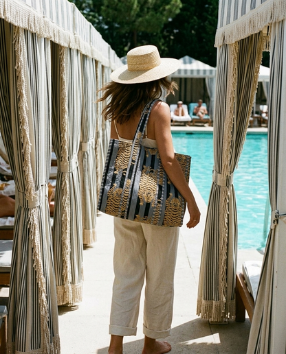 Beach club cabana row walk with the Tibetan Tiger Tote in Black and Grey over shoulder — handmade in Rajasthan by Conscious Yoga Collective