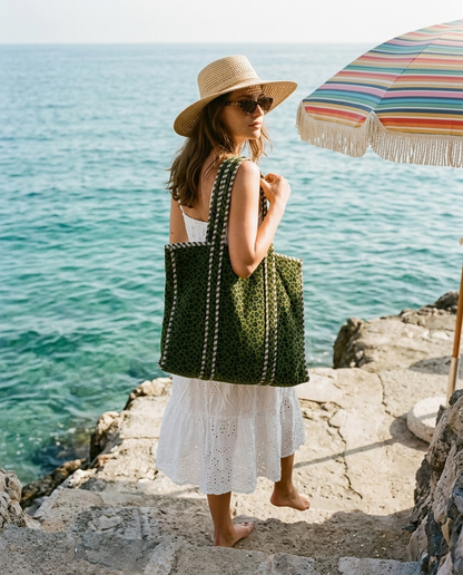Stone beach steps descent with the Velvet Leopard Tote in Green over shoulder — handmade in Rajasthan by Conscious Yoga Collective