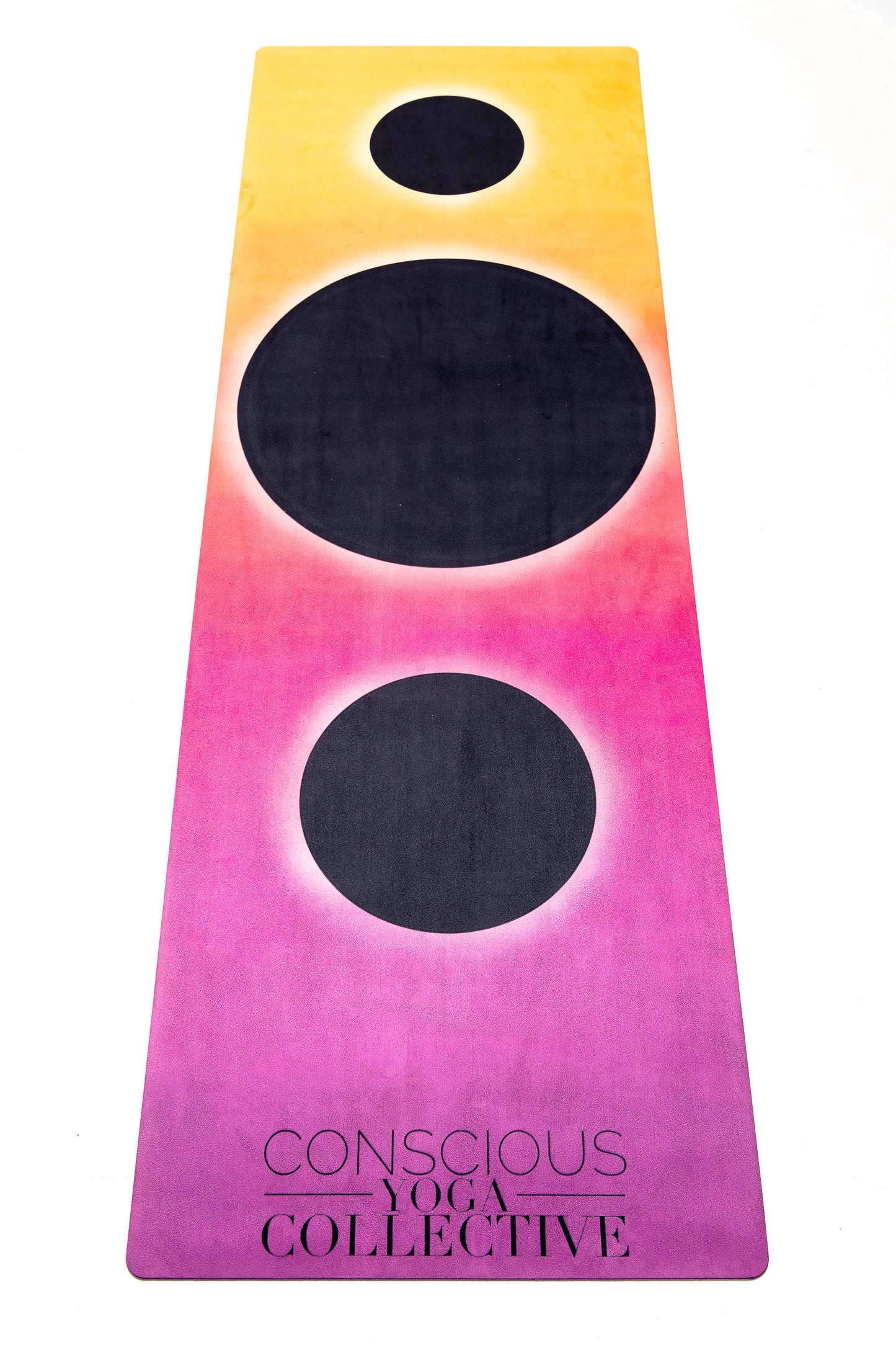 conscious yoga collective yoga mat with pink yellow and black holes fade