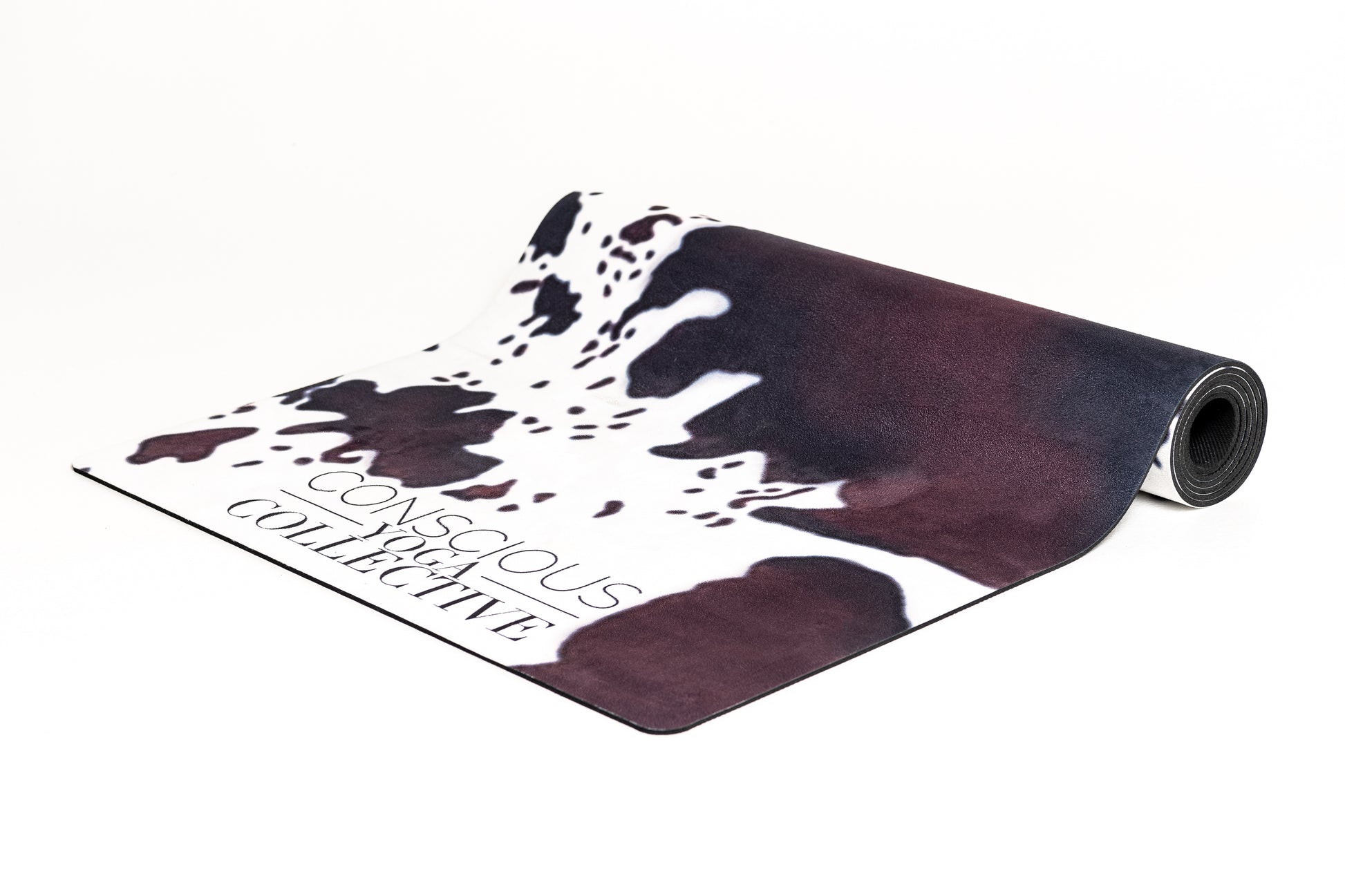 conscious yoga collective yoga mat with cowhide print in brown black and white