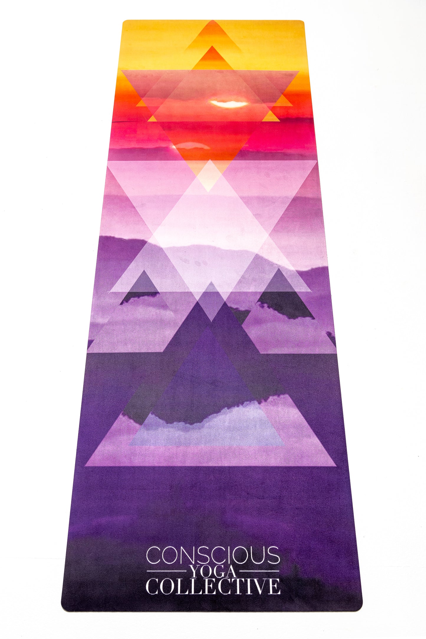 conscious yoga collective yoga mat with sunrise over mountains print with triangles overlaying i